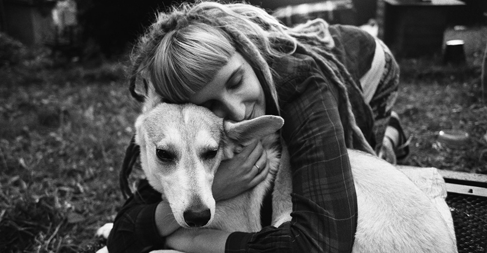 hugging dog, calming down dog with physical contact, cuddling dog